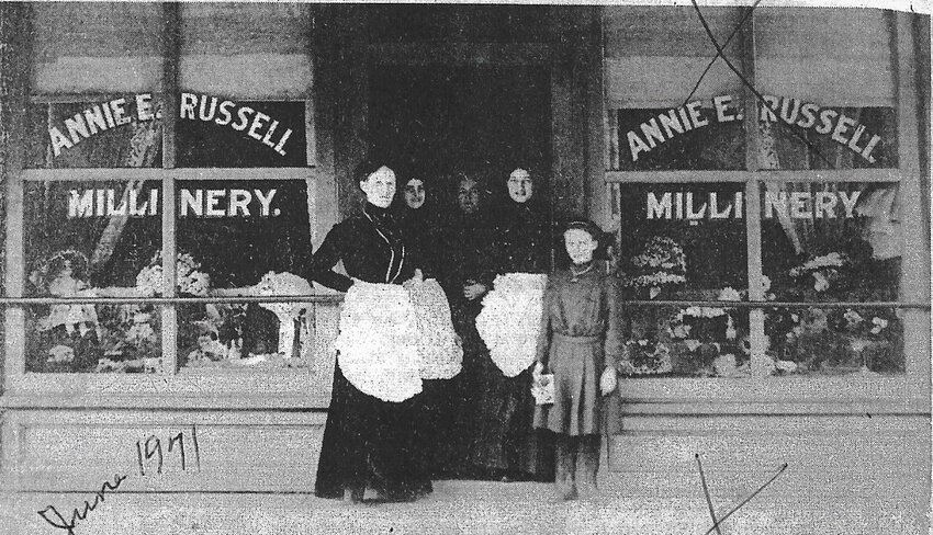 Millinery in Eldon at 109 S. Maple circa 1900-1910. From left: Annie E. Russell whose husband Tom had a grocery store just south of the millinery shop, Miss Pearl Winnop (became Mrs. W. C. Shepard), Mrs. Pinckney Berry, Mrs. Ina Van Way, and Annie's daughter Dollie. The frame building was razed in 1950. (Photo from scrapbook at the Miller County Museum. Likely published in June 1971 Advertiser.)