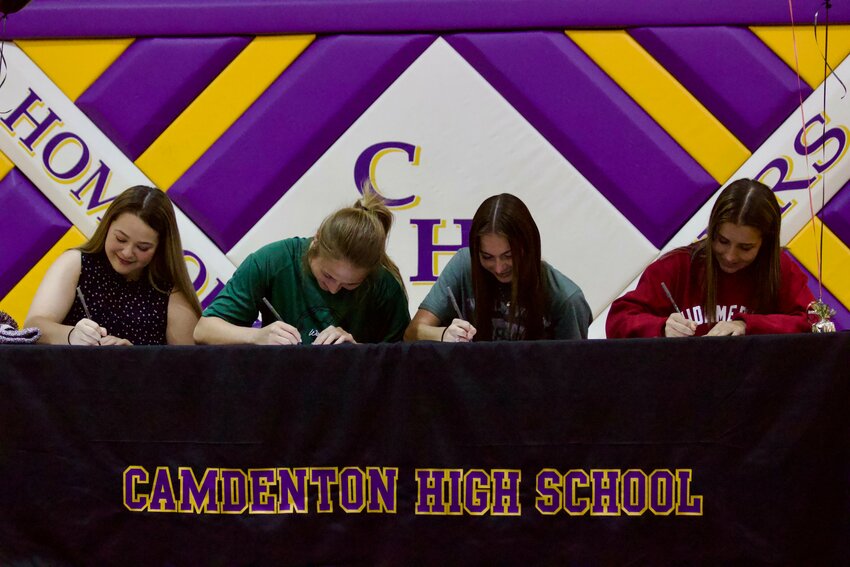 Camdenton athletes (from left) Sydney Righter (Fort Scott Community College, golf), Zoe Lockhert (William Woods University, soccer), Addyson Clay (William Woods University, soccer) and Makenna Brauer (MidAmerica Nazarene University, soccer) signed their college letters on Wednesday, April 17, in the CHS auxiliary gym.
