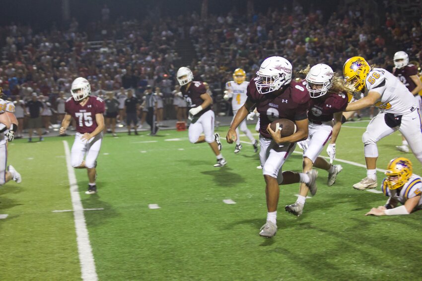 Indians' junior outside linebacker Drake Williams (No. 8) returns an interception for a touchdown late in the third quarter during the 35-0 win over the Liberators from Bolivar on Friday, Aug. 30, at the SOTO Sports Complex.