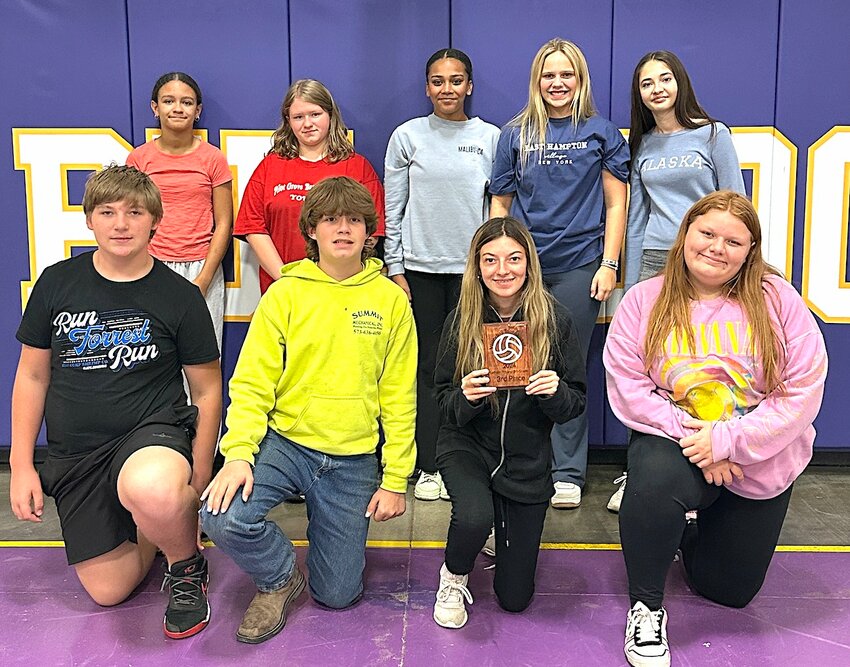 The Clarksburg Bulldog Volleyball Team finished third in the Latham Tournament and posed with their trophy. From the left are: Front, Bentley Edwards, Kenny Lindemann, Josie Long, Kaylei Henry; back, Aliyah Calvert, Morgan Cole, Kiera Washington, Annie Murphy and Maddie Senter.