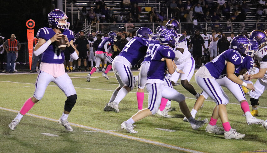 Camdenton seniors, cornerback Johnny Semau (No. 88) along with safeties Kaidyn Bowen (No. 0) and Lukas Routh (No. 4) work to bring down a Columbia-Hickman Kewpie during the 35-30 homecoming win on Friday, Oct. 11, at Bob Shore Stadium.