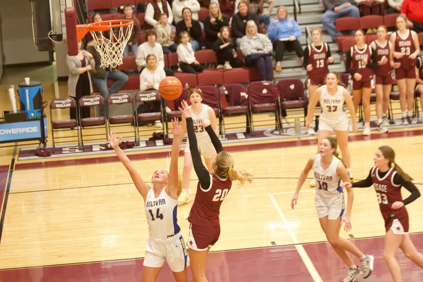 Osage senior forward Bailey Groth (No. 20) puts up a shot in the fourth quarter during the 56-49 loss in the Class 4, District 10 district tournament on Thursday, Mar. 6, held at the Henderson Gymnasium.