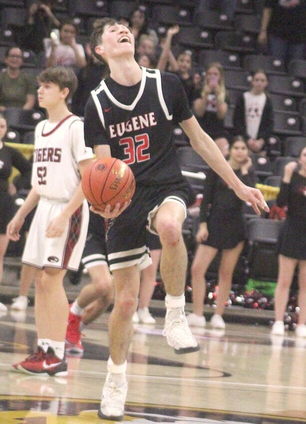 Eugene’s Isaac Busch gets ready to toss the basketball as the clock strikes zero during the Eagles’ 72-61 win over the Canton Tigers in the MSHSAA Class 2 championship game Thursday, March 14, at Mizzou Arena. Busch, a senior, scored 23 points in the game as the Eagles finished 28-4 with their first state championship in any sport at Eugene.