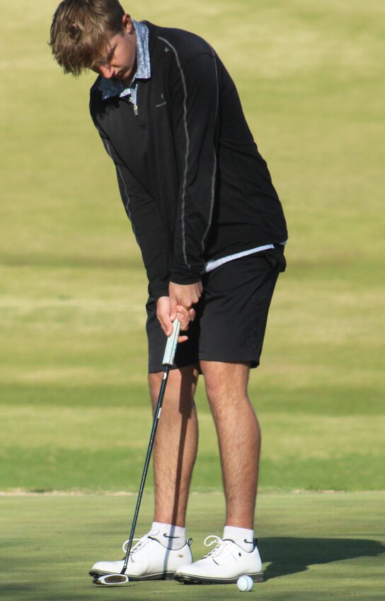 Eldon's Talon Hull sinks his putt on the No. 2 hole at Eldon Golf Club during the varsity Mustangs' win over Iberia and Fulton Tuesday, April 8.