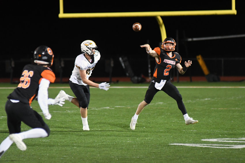 Brendan Decker (above, far right) throws a pass down the field to Owensville wide receiver Bryce Payne (above, far left) during Owensville&rsquo;s 35-6 victory Friday night over Sullivan on their Dutchmen Field home turf. OHS hosts St. Clair Friday for senior night beginning at 7 p.m.