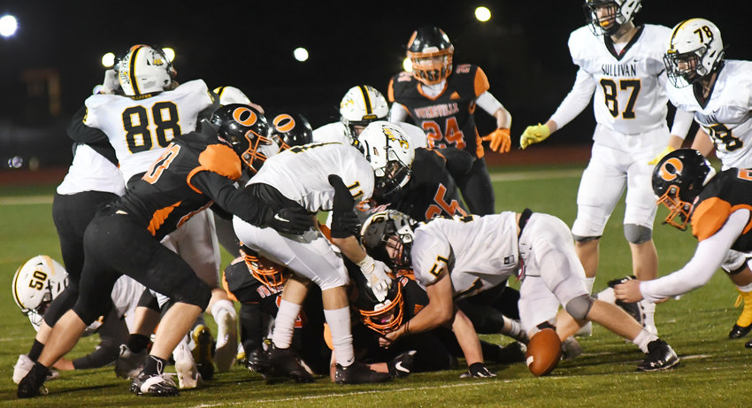 Logan Evans (far right) falls on a fumble that led to Owensville&rsquo;s final touchdown during their 35-28 victory over Sullivan&rsquo;s Eagles advancing them to Friday&rsquo;s MSHSAA Class 3, District 4 championship game against Priory at Dutchmen Field.