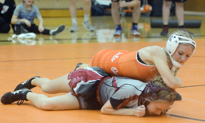 Jersey Reynolds (orange singlet) controls Rolla Lady Bulldog wrestler Bridgett Ragan during their varsity girls wrestling match at Owensville High School Thursday night before winning her match by fall at 115 pounds. Zach Bollman&rsquo;s Dutchgirls will compete Saturday in the Tough as Nails Tournament at Rolla High School starting at 9 a.m.