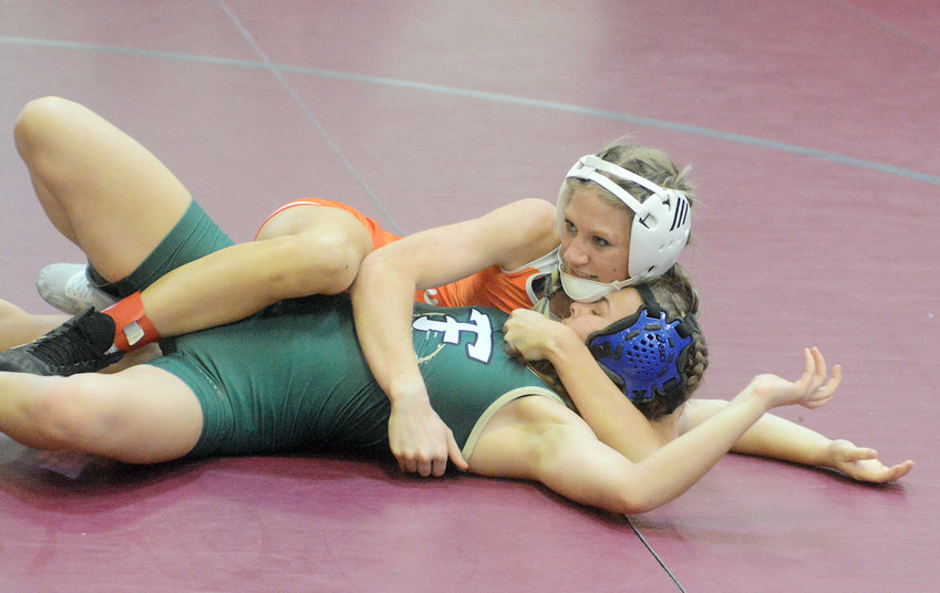 Jersey Reynolds, fine tunes her wrestling position against Lindbergh&rsquo;s Natalie Ford during round-one wrestling action in the Noel Tough as Nails Tournament Saturday at Rolla High School. Reynolds went on to place third at 110 pounds becoming the first Owensville Dutchgirl wrestler in school history to bring home a medal from a tournament.