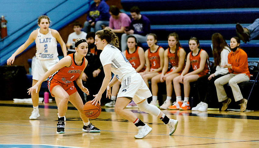 Emma Daniels (left) guards a Salem Lady Tiger ball handler during Owensville&rsquo;s 60-24 road victory last Tuesday night in Dent County. Ryan Flanagan&rsquo;s Dutchgirls continue action this week at the Hermann Tournament looking to defend their title from last year.
