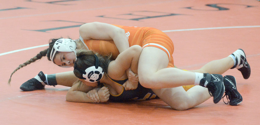 McKenzy Echols (orange singlet) controls Smith-Cotton&rsquo;s Brooklyn Hoecker during first-round action at 141 pounds during the MSHSAA Class 1, District 2 Girls Wrestling Tournament at North Point High School in Wentzville.