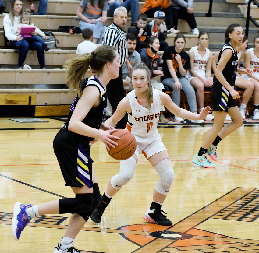 Camryn Caldwell (center) plays defense against Hickman&rsquo;s Lady Kewpies Friday night at Owensville High School. Falling 65-57 to the sixth-ranked Class 6 squad from Columbia. Owensville will a home game tonight (Wednesday) against Hermann and Friday against New Haven with both set for 5:30 p.m., start times.