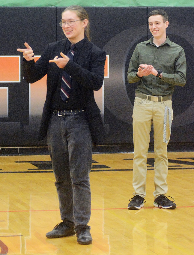 Owensville High School&rsquo;s Caden Binkhoelter reacts  at being named winner of the $10,000 Gasconade County Math and Science Scholarship given by the Gerald Ebker family. Applauding (right) was Binkhoelter&rsquo;s OHS Class of 2022 classmate Michael Lowes who was among the 12 students from OHS and Hermann to compete for the scholarship through a testing process.