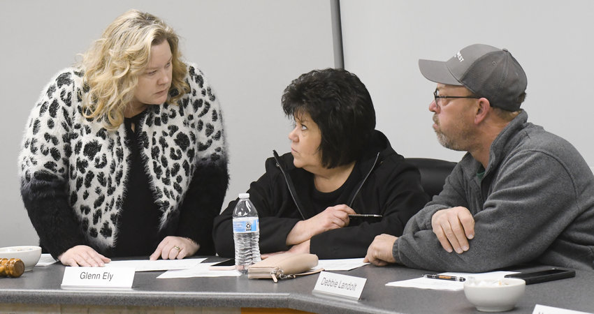 R-2 Superintendent Dr. Jeri Kay Hardy (left) goes over a list of capital projects on Monday during a Long Range Facility Committee meeting with Board of Education member Debbie Landolt and Gary Pohlmann, the district&rsquo;s transportation director.