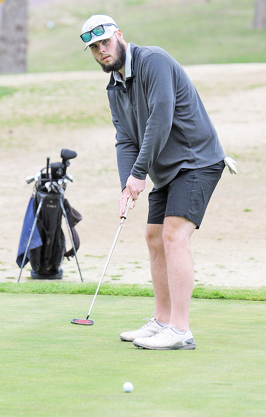 Tyler Perkins watches his putted ball go towards the hole during Owensville&rsquo;s season-opening golf meet at Cuba Lakes Golf Course against the host Wildcats, Belle&rsquo;s Tigers and Newburg&rsquo;s Wolves.