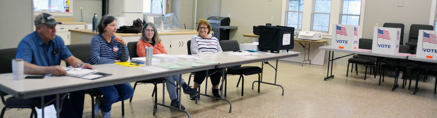 Bland precinct polling judges waited at Zion Evangelical Church. At 8:25 a.m., they reported 16 votes cast.