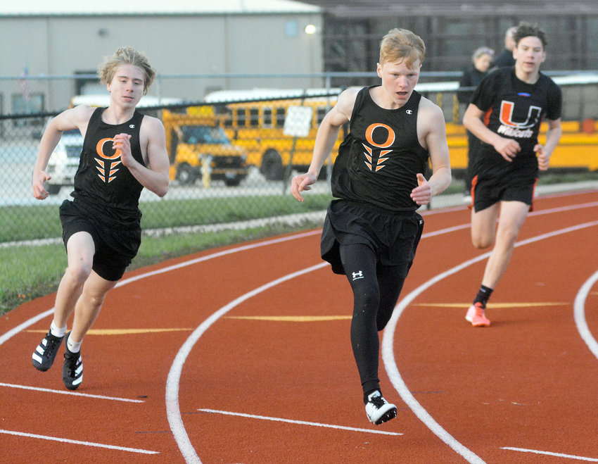 Connor Wellman and Cody Lenauer (from left) look to stay ahead of Union&rsquo;s Hunter Pruitt during the boys 200-meter dash