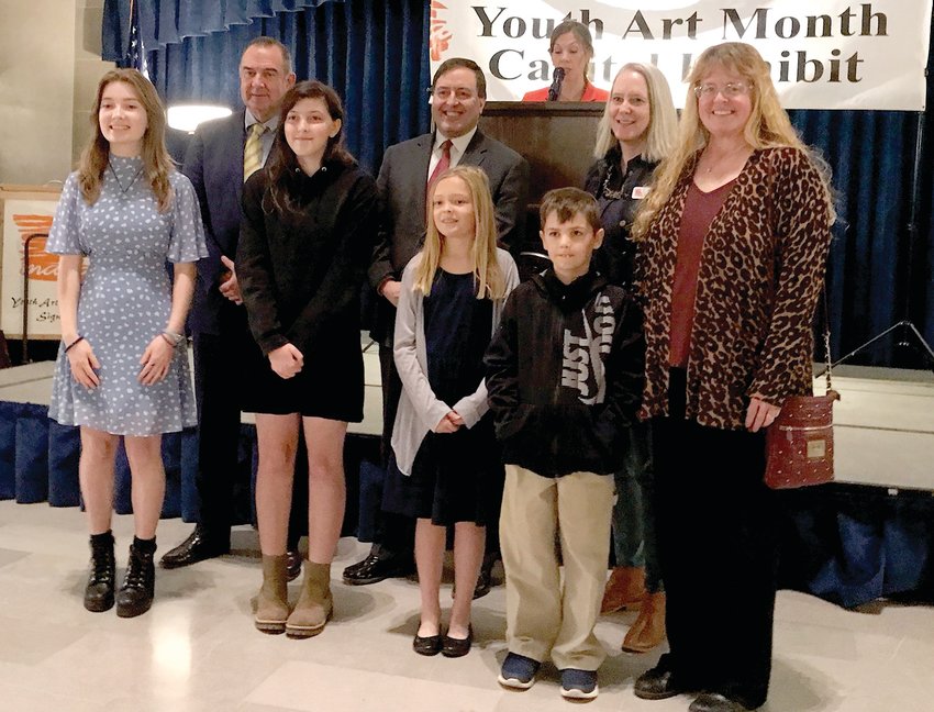 Chamois R-1 art students Rylee Davis, Brooklyn Whited, Carly Schollmeyer, Braxton Uthe, and art teacher Joyce Wright, front row, were joined by Lt. Gov. Mike Kehoe, Secretary of State Jay Ashcroft, and Missouri Art Education Association President Hester Menier on March 21 at the 2022 Youth Art Month Capitol Exhibit&rsquo;s awards and recognition ceremony at the Missouri State Capitol.