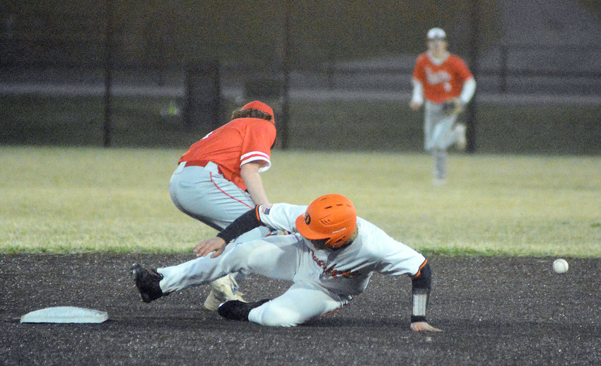 Eli Wilson (middle) slides safely into second base for Tyler Ahring&rsquo;s Owensville Dutchmen during preseason Four Rivers Conference (FRC) Tournament action against St. James at OHS Field.