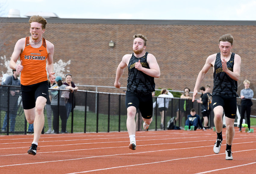 Charlie Whelan (far left) sprints ahead of a pair of Sullivan Eagles during one of several heats of the boys 100-meter dash in last Tuesday&rsquo;s home track meet at Dutchmen Field. Due to Good Friday, the annual OHS Relays will be held tomorrow (Thursday) and return to its traditional Friday slot next year.