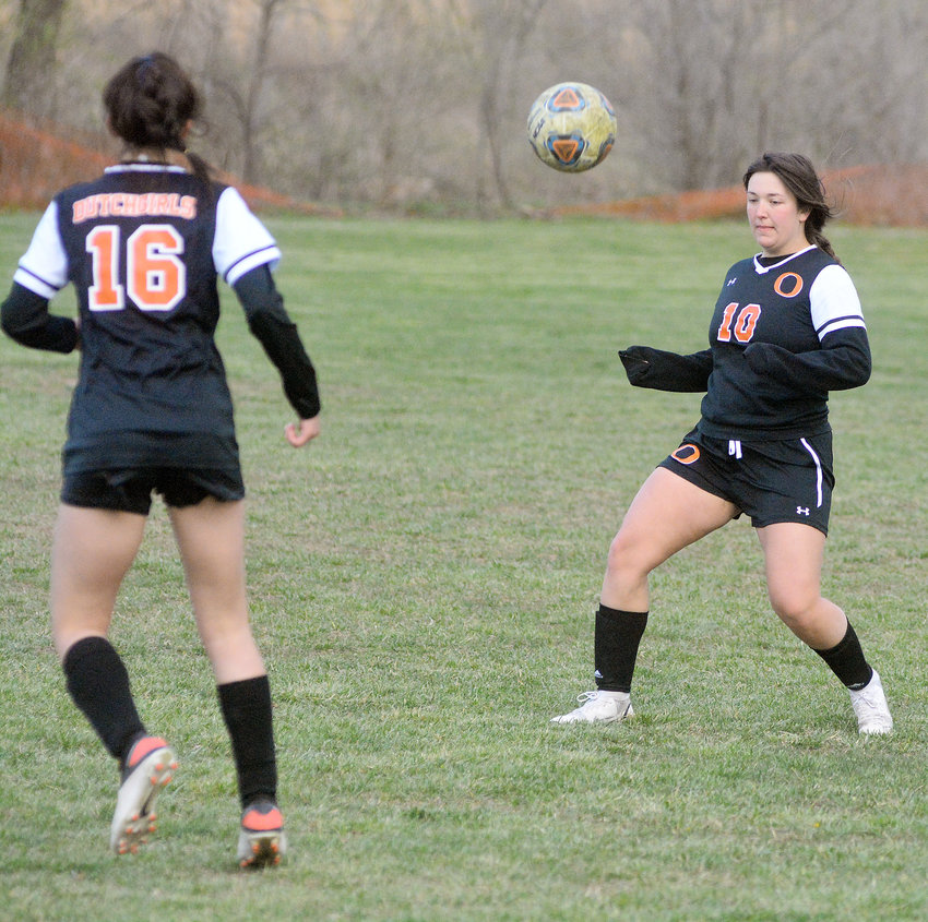 Avery Bastunas (right) waits for the ball to come down on the ground before playing it during the Dixon Girls Soccer Tournament last week against Belle&rsquo;s Lady Tigers. OHS will have four home matches next week beginning Monday against Battle (Columbia) at 5:30 p.m.