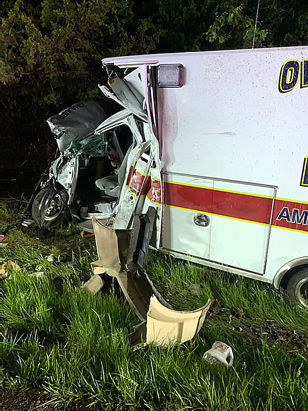 EXTENSIVE DAMAGE to the Owensville Area Ambulance District&rsquo;s 2019 Ford E-450 ambulance cab and truck box is evident from the impact of an eastbound car &mdash; turned upside down and sliding backward &mdash; which came into the crew&rsquo;s westbound U.S. 50 lane on Friday evening. Both crew members were injured; one seriously.