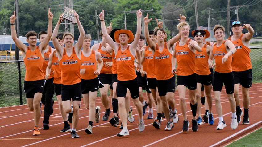 Owensville Dutchmen track team members celebrate their MSHSAA Class 3, District 5 team title with a victory lap around the track at Zizzer Stadium on the campus of West Plains High School Saturday afternoon.