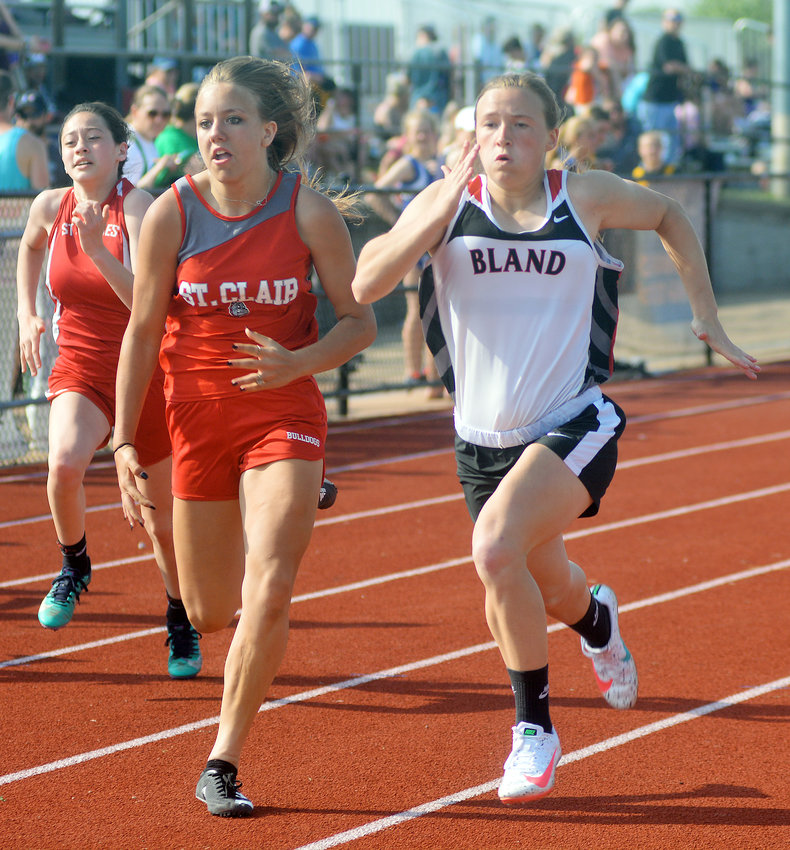 Aubrey Rehmert (far right) races alongside St. Clair&rsquo;s Alivia Webb in one of five heats of the girls 100-meter dash during the rescheduled Owensville Middle School (OMS) Relays held on Monday, May 9 at Owensville High School&rsquo;s Dutchmen Field. Rehmert broke a pair of Bland Middle School records in the girls discus and the long jump during the meet that was rescheduled from mid-April due to inclement weather.