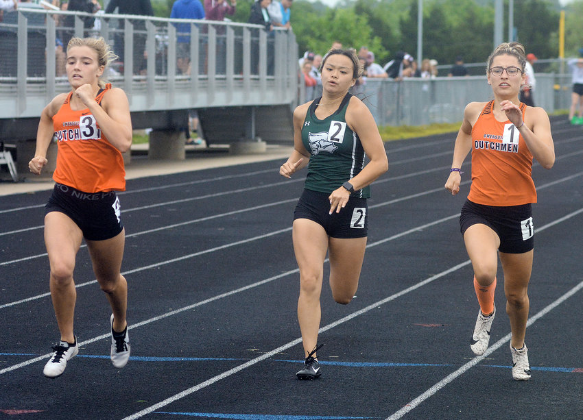 Emma Daniels (left) and Saylor Richardson (above, far right) sprint down the track in the girls 100-meter dash during one of four MSHSAA Class 3 Sectional Track meets held Saturday at Hollister High School in southwest Missouri. Both Dutchgirl sprinters placed in the top four to advance to state this weekend in Jefferson City.