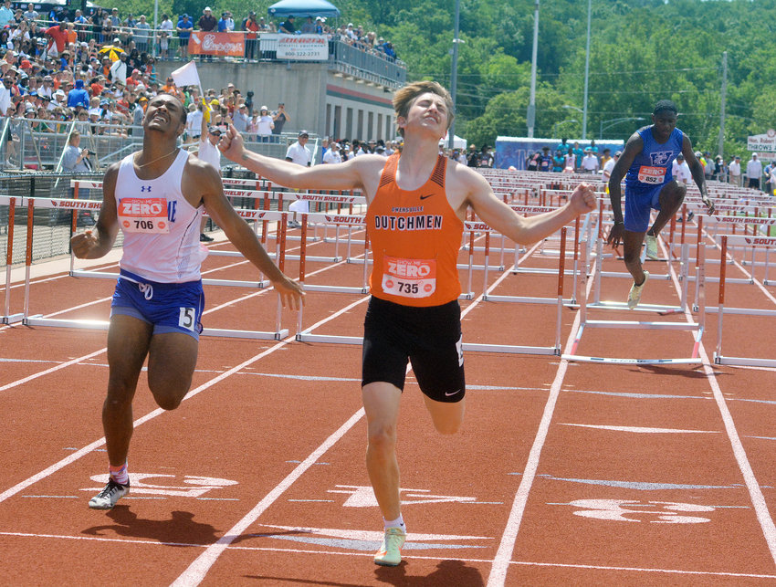 Bryce Payne (center) celebrates his state championship in the Class 3 Boys 110-meter hurdles during the Missouri State High School Activities Association (MSHSAA) State Track and Field Championships held over the weekend at Jefferson City High School&rsquo;s Dennis and Roberta Licklider Track Complex inside of Adkins Stadium. Payne&rsquo;s state title is the first individual one for Owensville High School since Bryan Candrl won the pole vault back in 2018.
