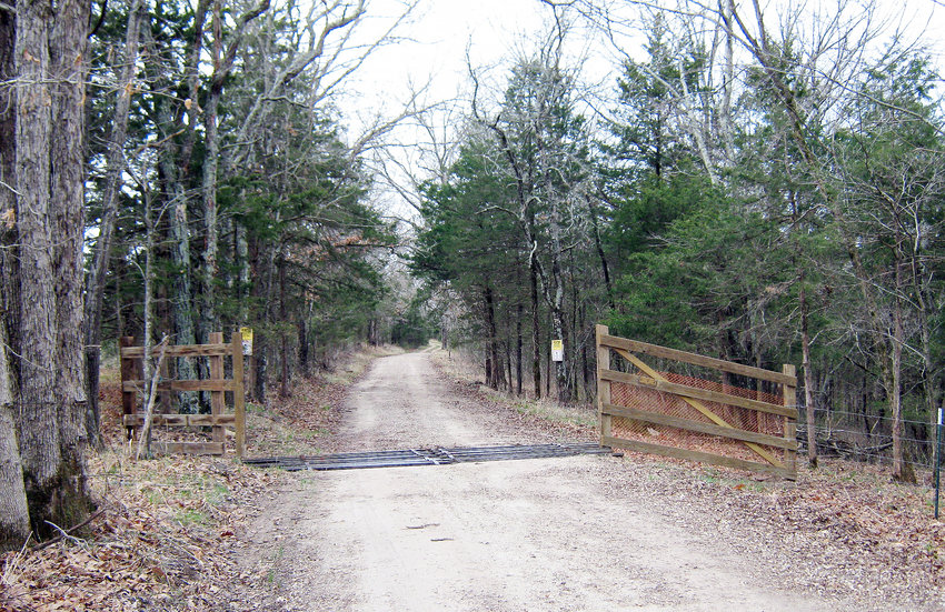 This is MCR 306, which leads to the Gasconade River Fish Hollow Access. Commissioner Drewel recently was told the cattle guard on the road replaced a gate the old timers used to pass through when they had trail rides with horses and wagons.