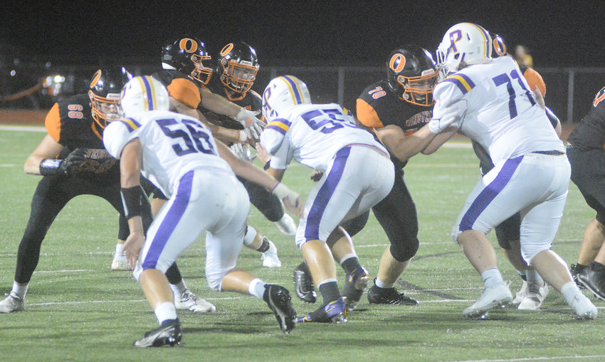 Brent Helmig (far right) provided protection for Owensville Dutchmen senior quarterback Brendan Decker during their 9-3 season in 2021 which saw them end a five-year district title drought with a win over Priory&rsquo;s (St. Louis) Ravens before Cardinal Ritter ended their season in the quarterfinals.