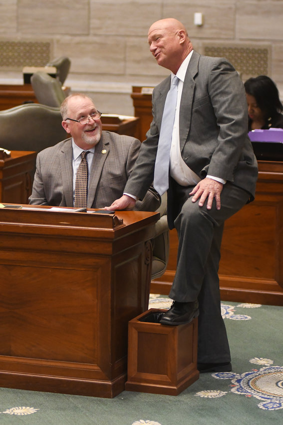 STATE SENATORS Dave Schatz (left) and Mike Bernskoetter visit in the Senate Chamber in March 2022 as a group was filibustering the reading of the Senate journal from the previous day into the record.