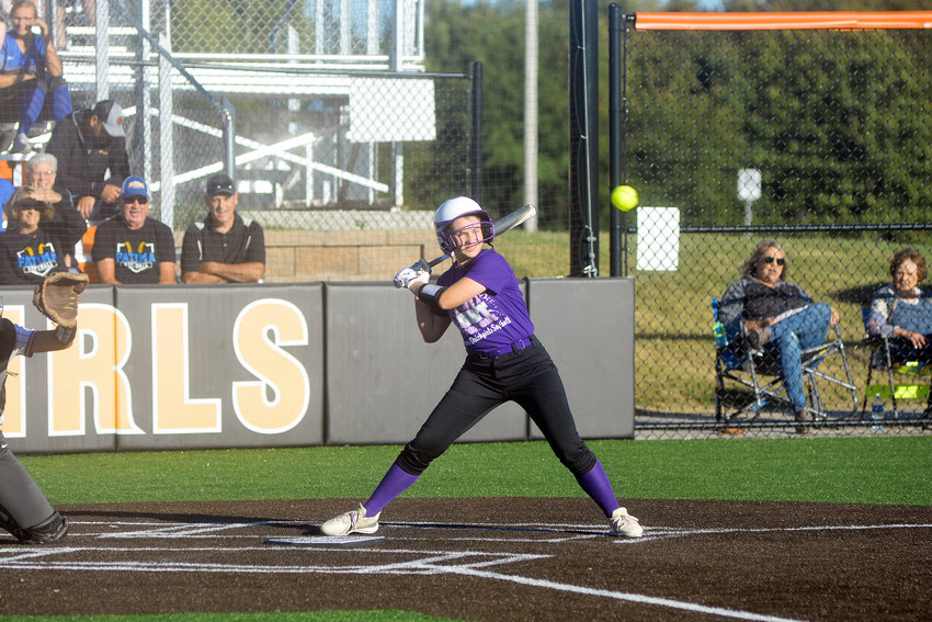 Grace Abell watches a high pitch go for ball for Owensville&rsquo;s Dutchgirls in their annual purple out game last Monday night against Fatima&rsquo;s Lady Comets. Abell was diagnosed with Hodgkin&rsquo;s Lymphoma but has since rang the bell declaring her free from the cancer.