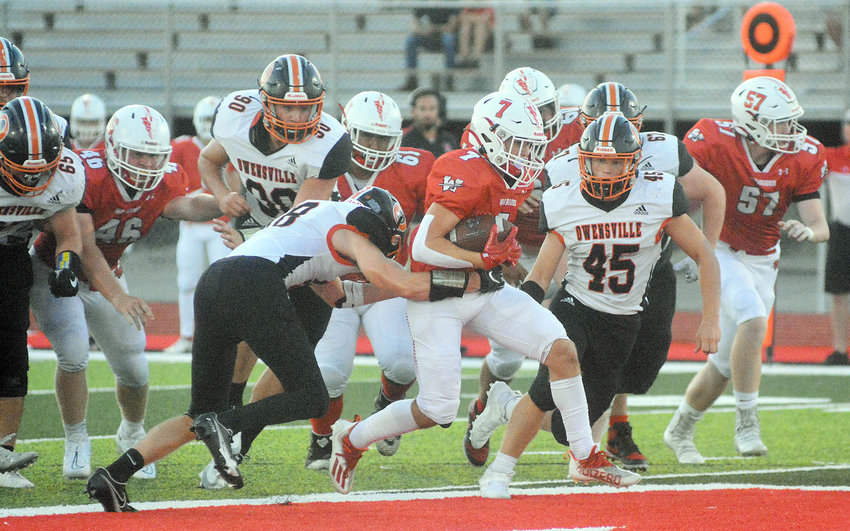 Jaden Gerlemann (far right) closes in on a Warrenton Warrior ball carrier during Owensville&rsquo;s 12-6 overtime victory in Warren County during week three of the recently-completed high school football season for Nathan Cabot&rsquo;s Owensville Dutchmen.