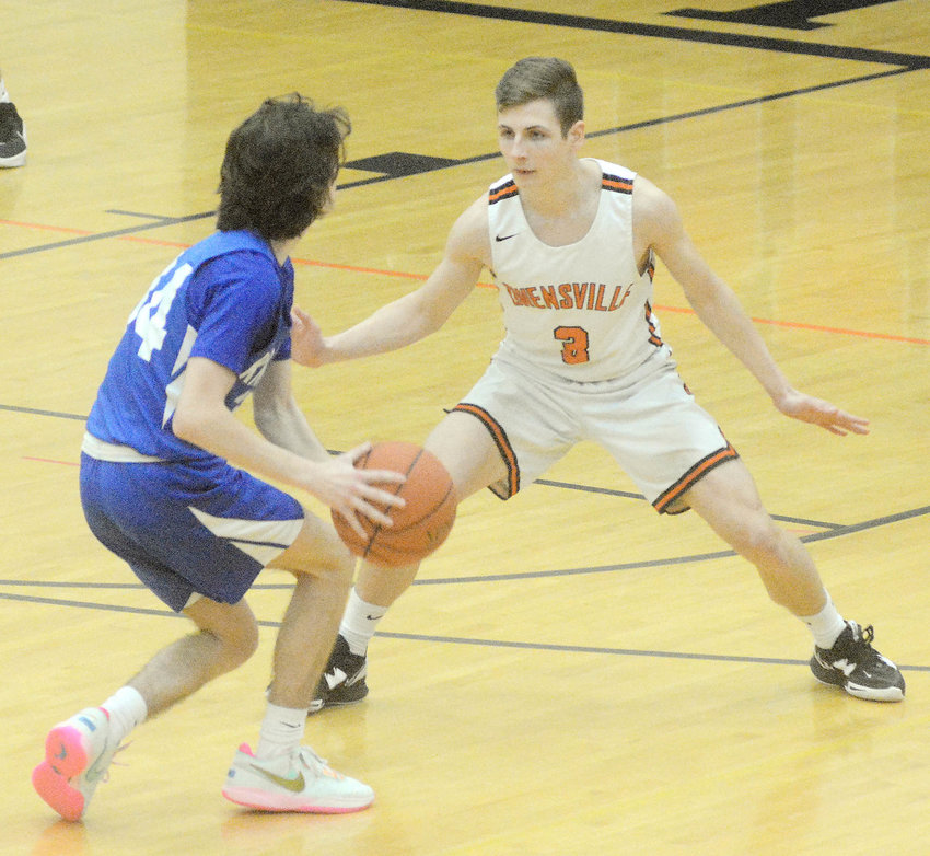 Austin Luecke (above, right) assumes his defensive stance late Friday afternoon guarding Isiah Tucker during the seventh-place game of the 34th Owensville Varsity Boys Basketball Tournament presented by The Maries County Bank. Luecke and his Dutchmen teammates went on to defeat the St. Louis JV Blue Knights 72-49. Hosting Steelville&rsquo;s Cardinals last night (Tuesday) OHS will have nine days to prepare for the trip to Frontenac, Ks., and the Kansas National Guard Basketball Tournament from Jan. 19-21.