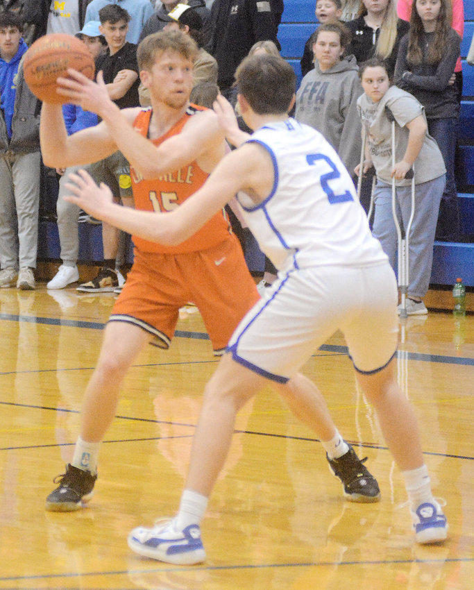 Charlie Whelan (left) looks for someone to pass the ball to during Four Rivers Conference (FRC) basketball action nearly two weeks ago at Hermann. Cullen VanLeer&rsquo;s Dutchmen will host St. James Friday night for homecoming and Sullivan next Tuesday for senior night to end their regular season.