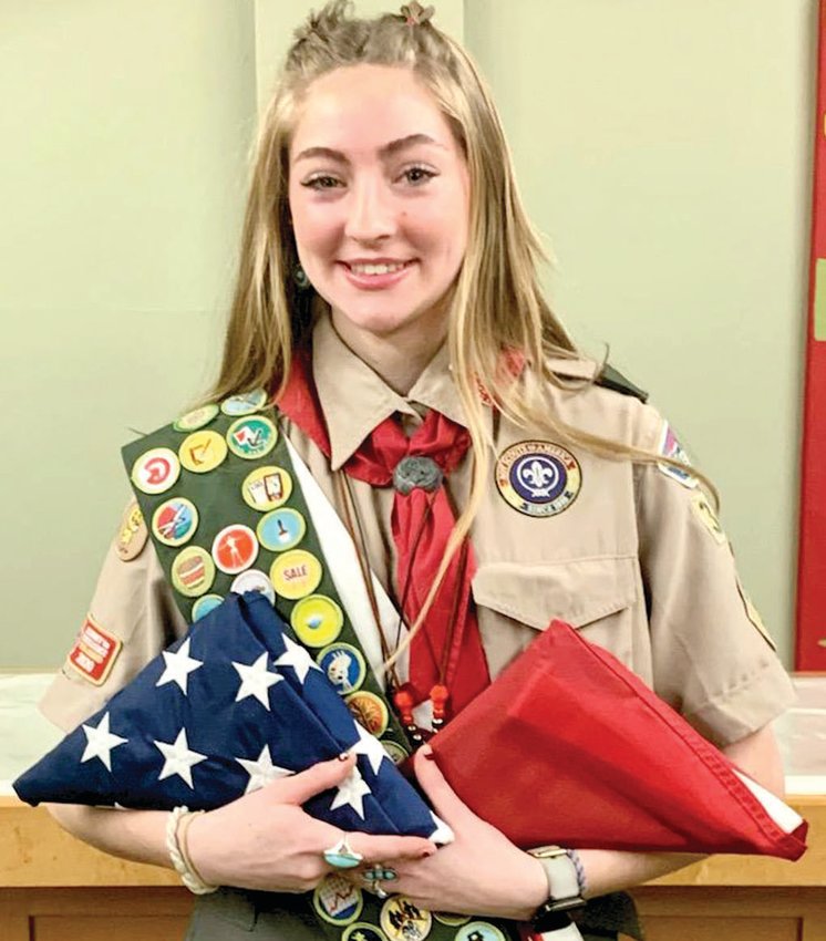 Linn teen Grace Wagner shows off the American and Missouri flags that were flying over the capitol on the day she earned Eagle Scout. She will be honored with a House Resolution on Feb. 27 by Rep. Bruce Sassmann.