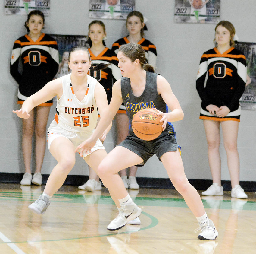 Anya Binkhoelter (left) keeps her eye on Fatima&rsquo;s Lucy Crede handling the basketball during last Thursday&rsquo;s MSHSAA Class 4, District 10 semifinals at Blair Oaks High School.