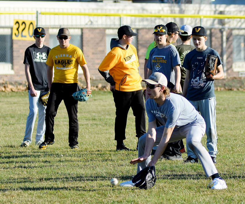 Sam Rowden fields a ground ball in the outfield at Vienna City Park during a recent practice session for Vienna Eagle baseball. Weather and field conditions permitting, they will host a four-team jamboree Friday night beginning at 4:30 p.m. Teams competing along with the host Eagles include Clopton&rsquo;s Hawks, Iberia&rsquo;s Rangers and Stoutland&rsquo;s Tigers.