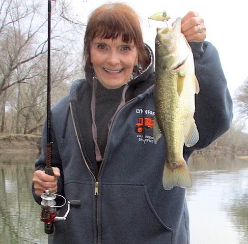 Nancy smith Lynn with a fat bass.  The lure at the top is the old swimming minnow.