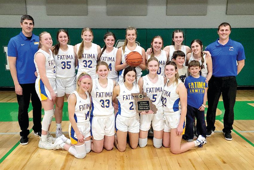 The Lady Comets claimed their first district title since 2014 with Saturday&rsquo;s win over Eldon. Team members are, from left to right, front row, Kaitlyn Plassmeyer, Lydia Brunnert, Claire Bexten, Emma Bower, Ellie Brune, and Lincoln Baker; and in the back row, Coach Matt Baker, Kristen Robertson, Payton Wieberg, Madelyn Backes, Lucy Crede, Alli Robertson, Alex Berhorst, Vivian Bax, Natalie Wilbers, and Asst. Coach John Fick.