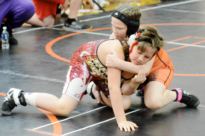Mallory Stockton (right) looks to score a two-point takedown during the Missouri USA District 7 Wrestling Tournament held Saturday, March 4 inside both the Owensville High School (OHS) main and small gyms.