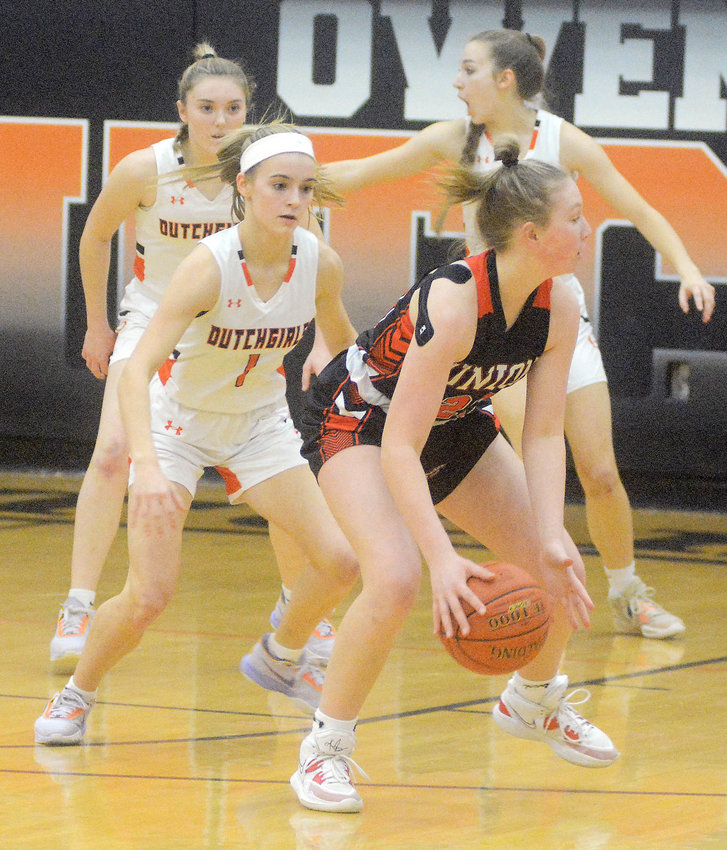 Emma Daniels (far left) keeps her eyes on Union&rsquo;s Sophia Helling handling the basketball during Four Rivers Conference (FRC) girls basketball action at Owensville High School back in mid-February.