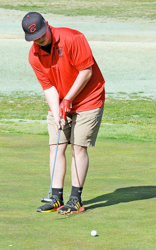 Myles Butler putts his ball on the first green at Cuba Lakes Golf Course Monday afternoon during the Cuba Lakes Golf Classic for John Viehland&rsquo;s Belle Tigers.