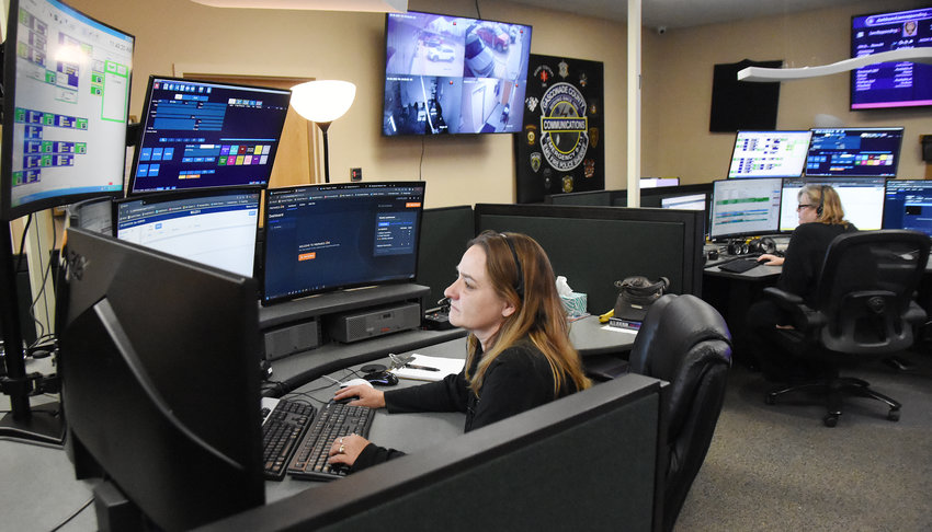 Gasconade E-911 dispatcher Dawn Humphrey (left) handles an out-of-state caller&rsquo;s request on April 6 for police assistance with a fraud case. Sandy  Lunceford, who handles GIS mapping for the county 911 service, was monitoring the call from her work station.