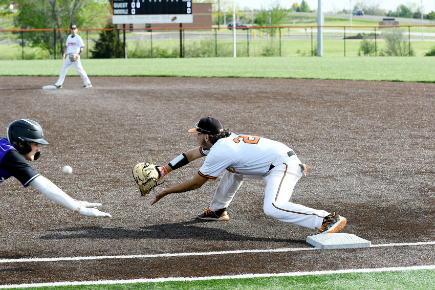 Wyatt Kramme (right) stretches from the first-base bag to catch the ball for the final out of the top of the second inning during Owensville&rsquo;s 21-0 Four Rivers Conference (FRC) varsity baseball loss Monday afternoon to Pacific at OHS Field.