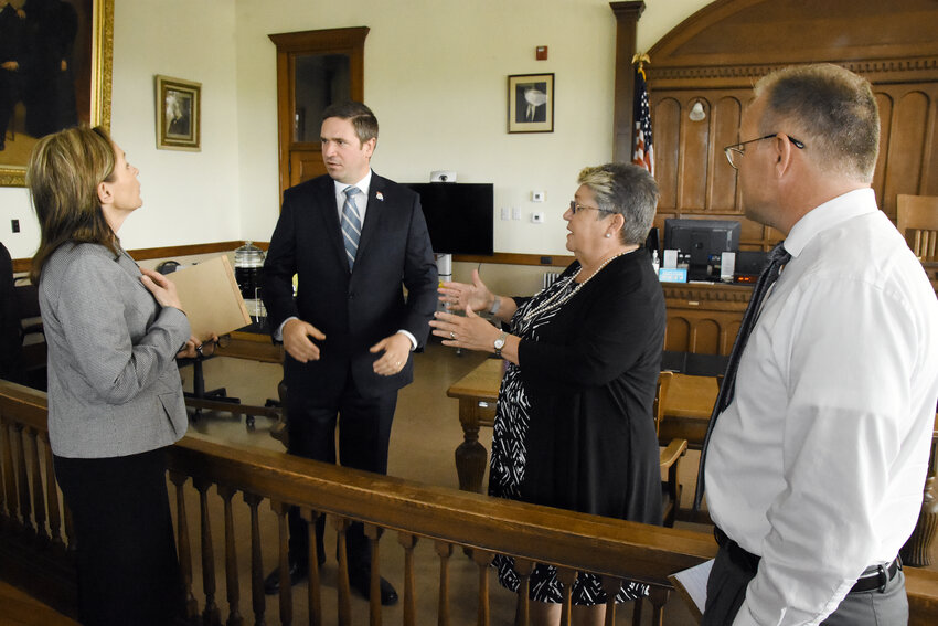 ATTORNEY GENERAL Andrew Bailey visits Friday with 20th Judicial Circuit prosecutors (from left) Amanda Grellner (Osage), Mary Weston (Gasconade) and  Matt Becker (Franklin) at the courthouse in Hermann.