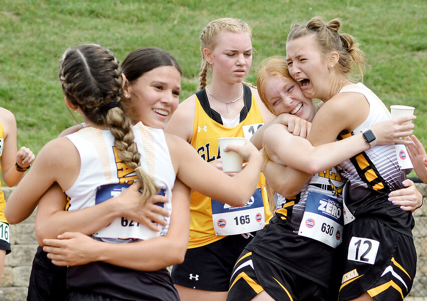 Vienna Lady Eagle 4x800-meter relay team members (from left) celebrating their sixth-place finish in the Class 1 girls race giving them All-State honors include Jaedyn Schell, Aubrey Reeves, Madison Weeks and Claudia Wieberg.