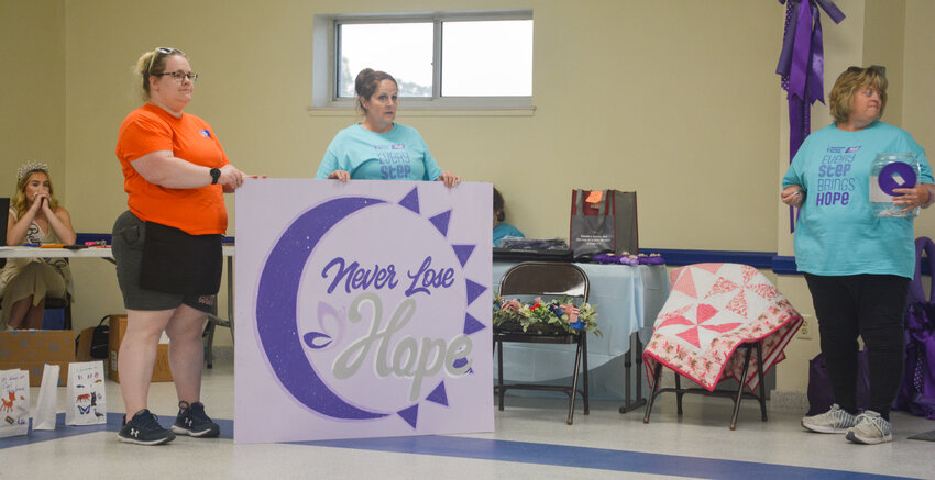 The Relay for Life of Osage and Maries Counties Drive through BBQ fundraiser featured two raffles, including one for cancer survivors. The survivors&rsquo; raffle featured homemade items such as the hand-painted &ldquo;Never Lose Hope&rdquo; sign held here by the organization&rsquo;s chair Nicki Bax.