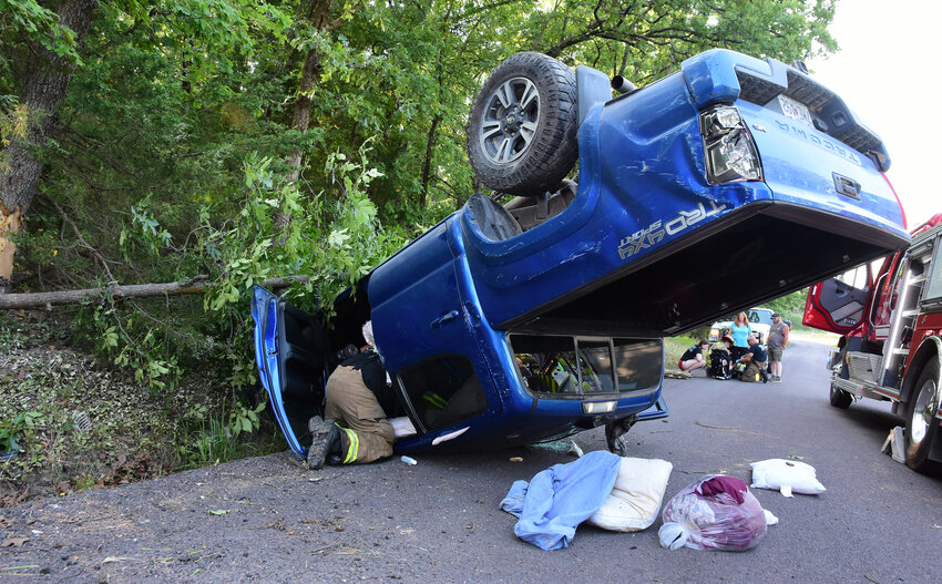 Owensville firemen assisted Monday evening at the scene of an overturned pickup truck on Holzschuh Road which injured a Gerald man.